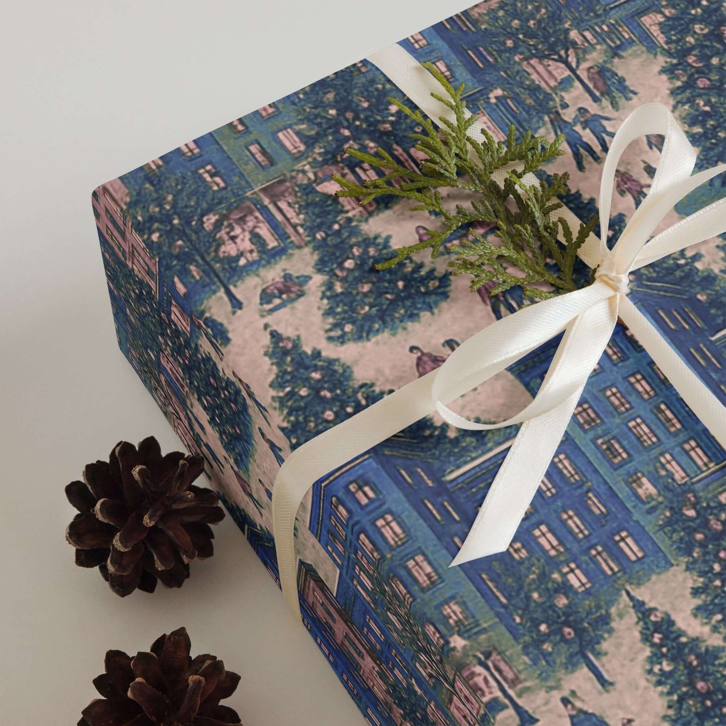 Luxury Christmas wrapping paper featuring a watercolor city skyline design with festive trees and holiday cheer.
