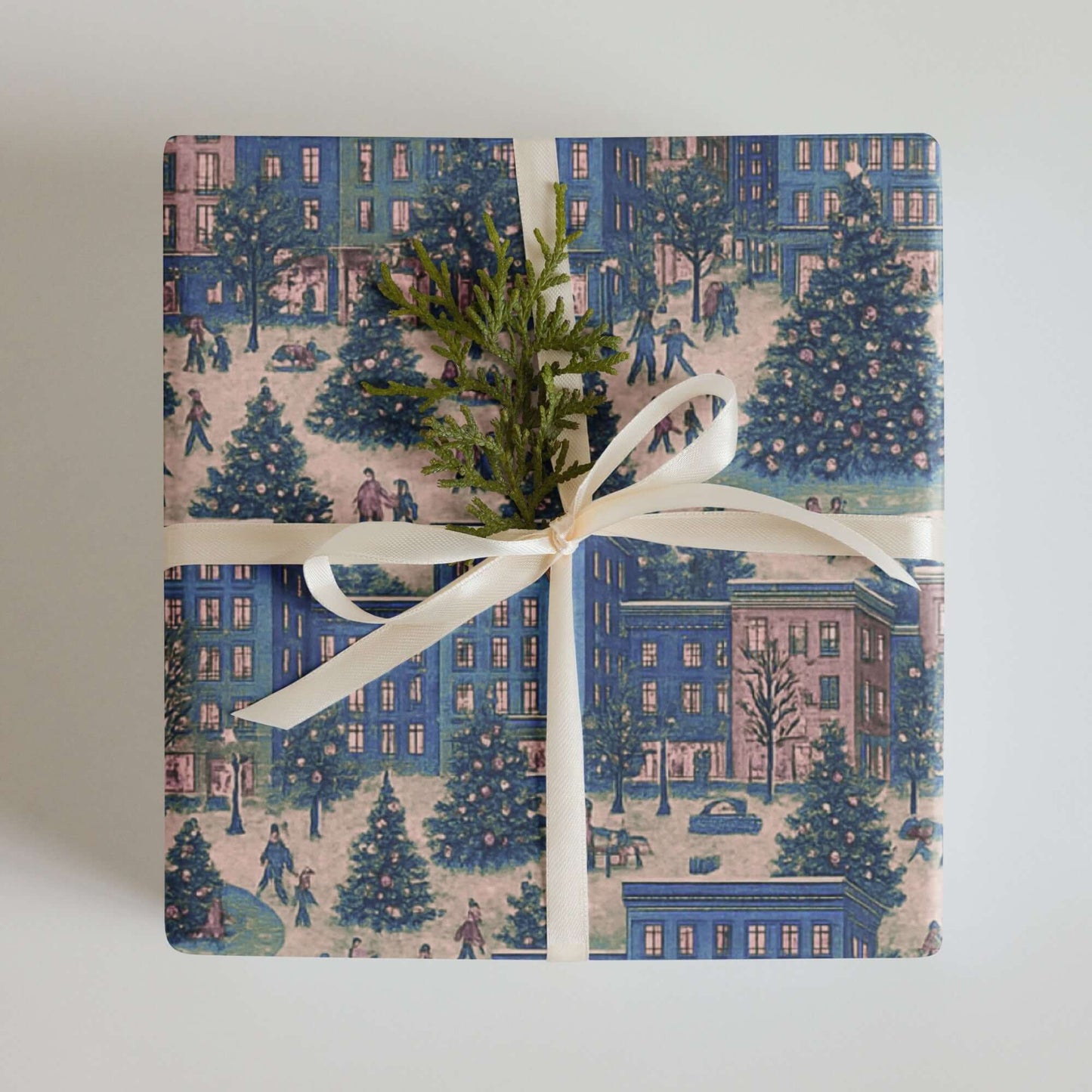 Luxury Christmas wrapping paper featuring a watercolor city skyline with holiday trees and cheerful urban goers.