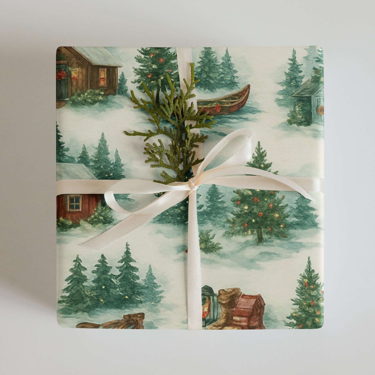 Rustic Christmas wrapping paper featuring watercolor scenes of log cabins, trees, and holiday accents, eco-friendly design.
