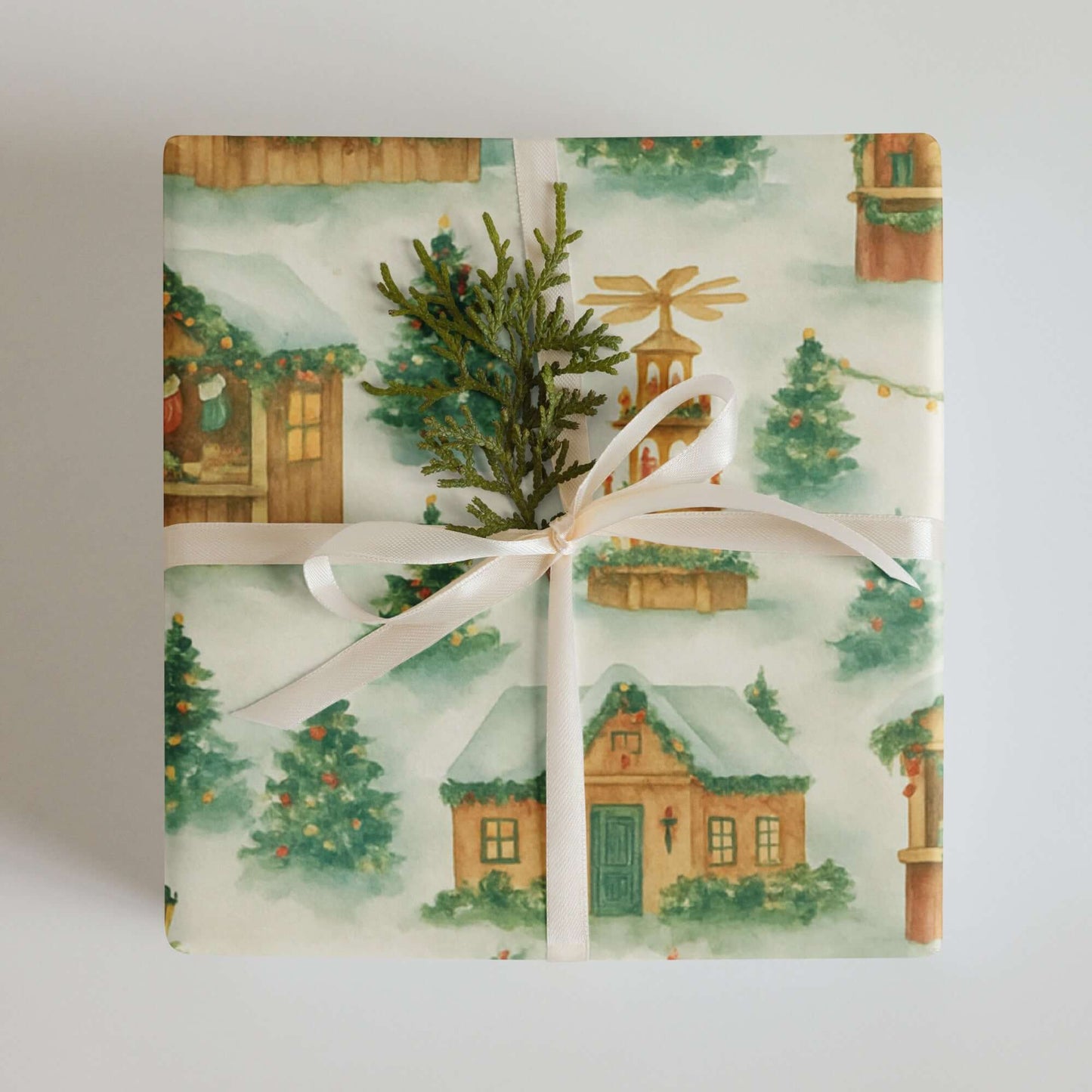 Luxury holiday gift wrap featuring watercolor designs of cozy homes, festive trees, and ornaments.