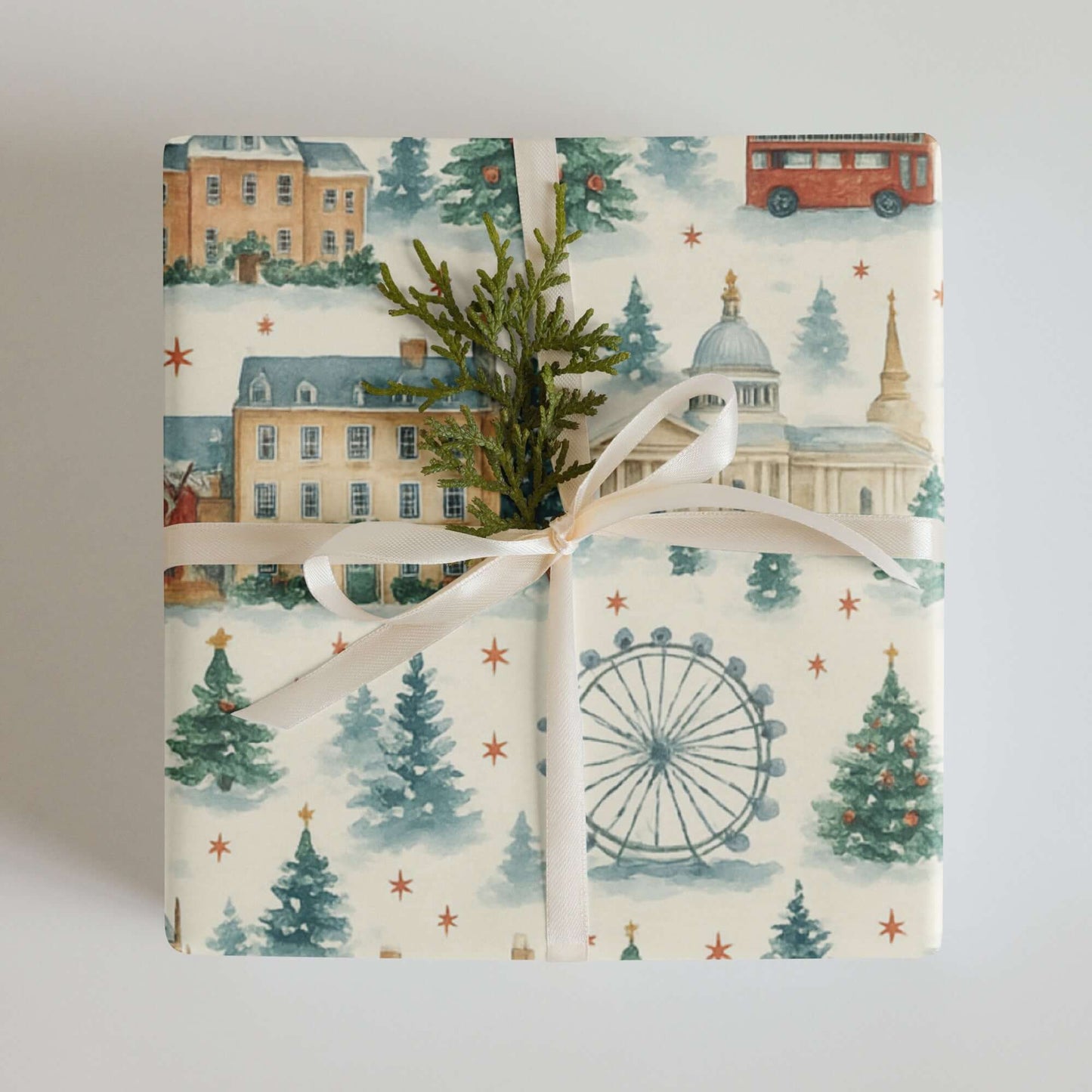 Luxury Christmas wrapping paper featuring London landmarks in a watercolor design, elegantly styled with greenery.