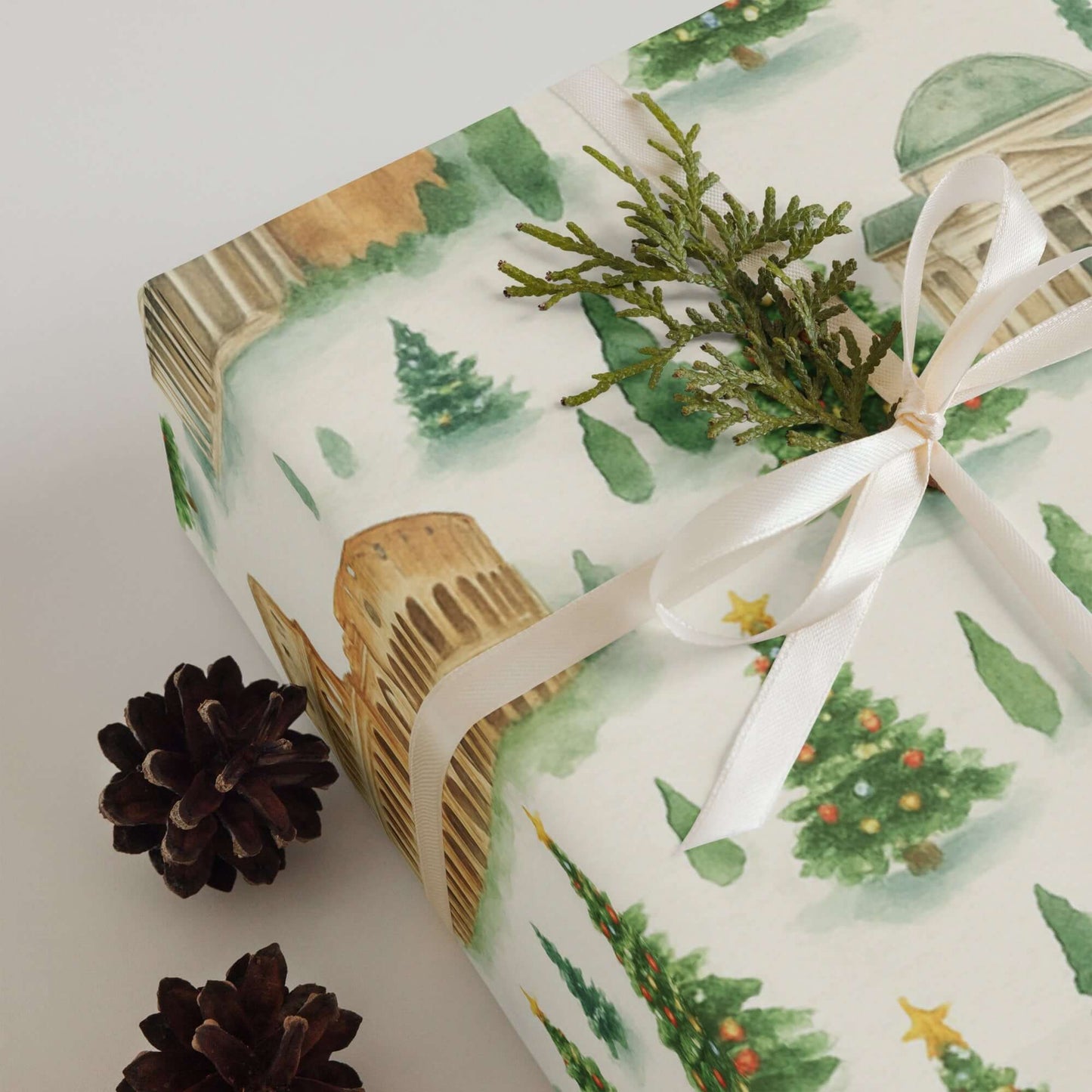 Luxury Christmas wrapping paper featuring iconic Roman landmarks in a watercolor design, adorned with pine and festive accents.