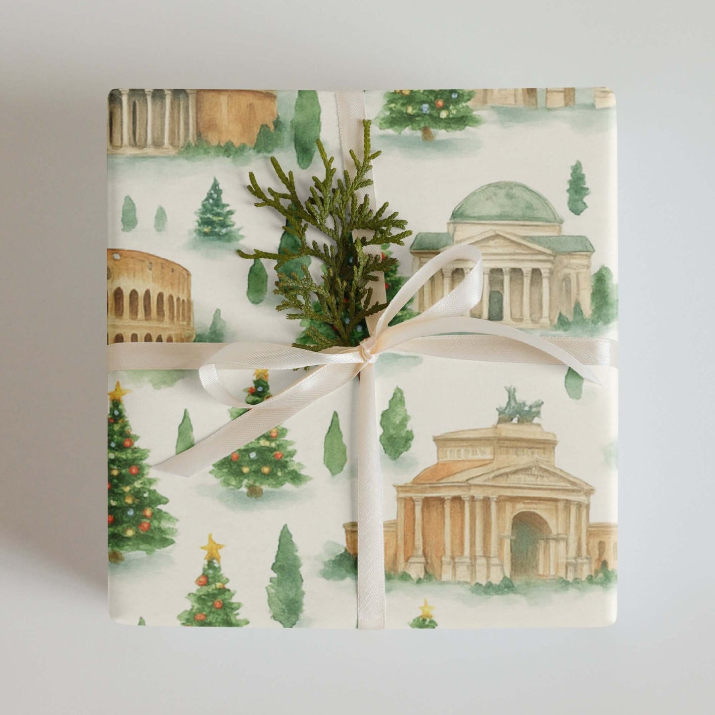 Luxury Christmas wrapping paper featuring iconic Roman landmarks in a watercolor design, adorned with festive greenery.