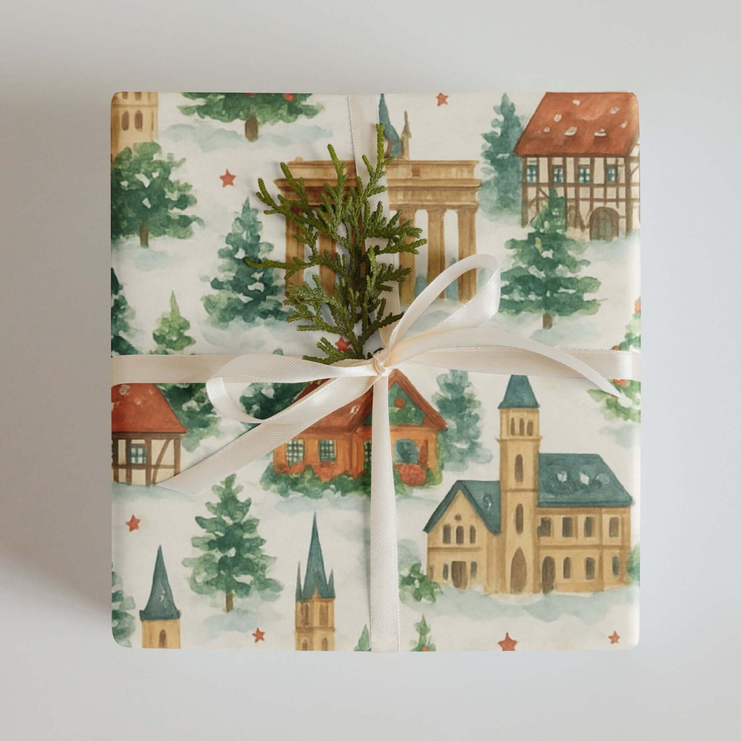 Luxury Christmas wrapping paper with watercolor design featuring German landmarks and festive greenery.