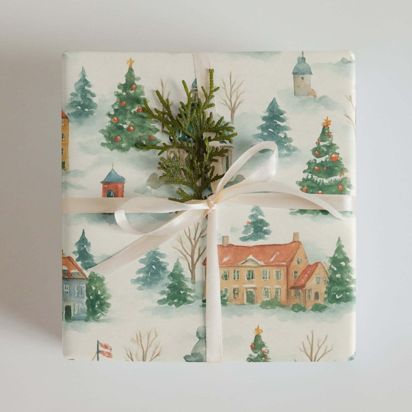 Luxury Copenhagen Christmas wrapping paper featuring watercolor holiday designs of festive trees and charming buildings.