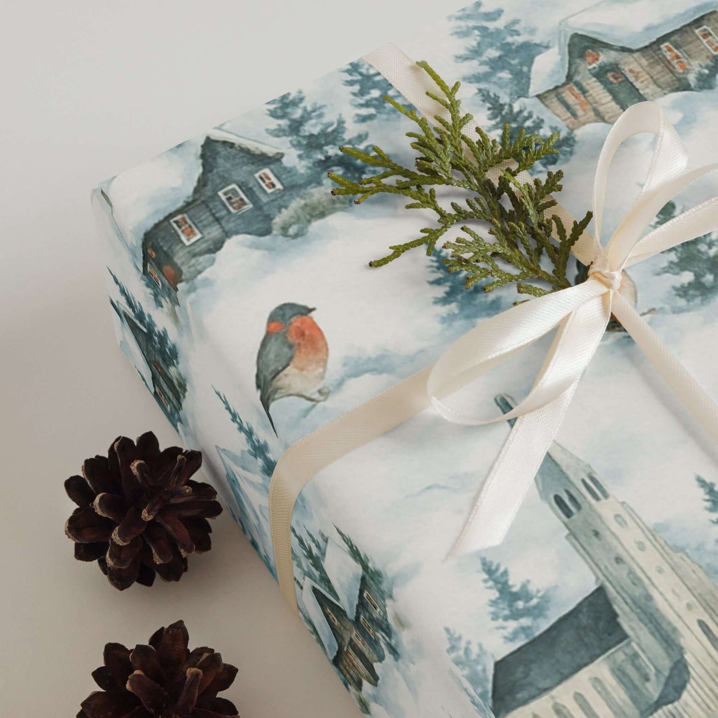 Luxury Christmas wrapping paper with watercolor design featuring snowy landscapes and festive accent.