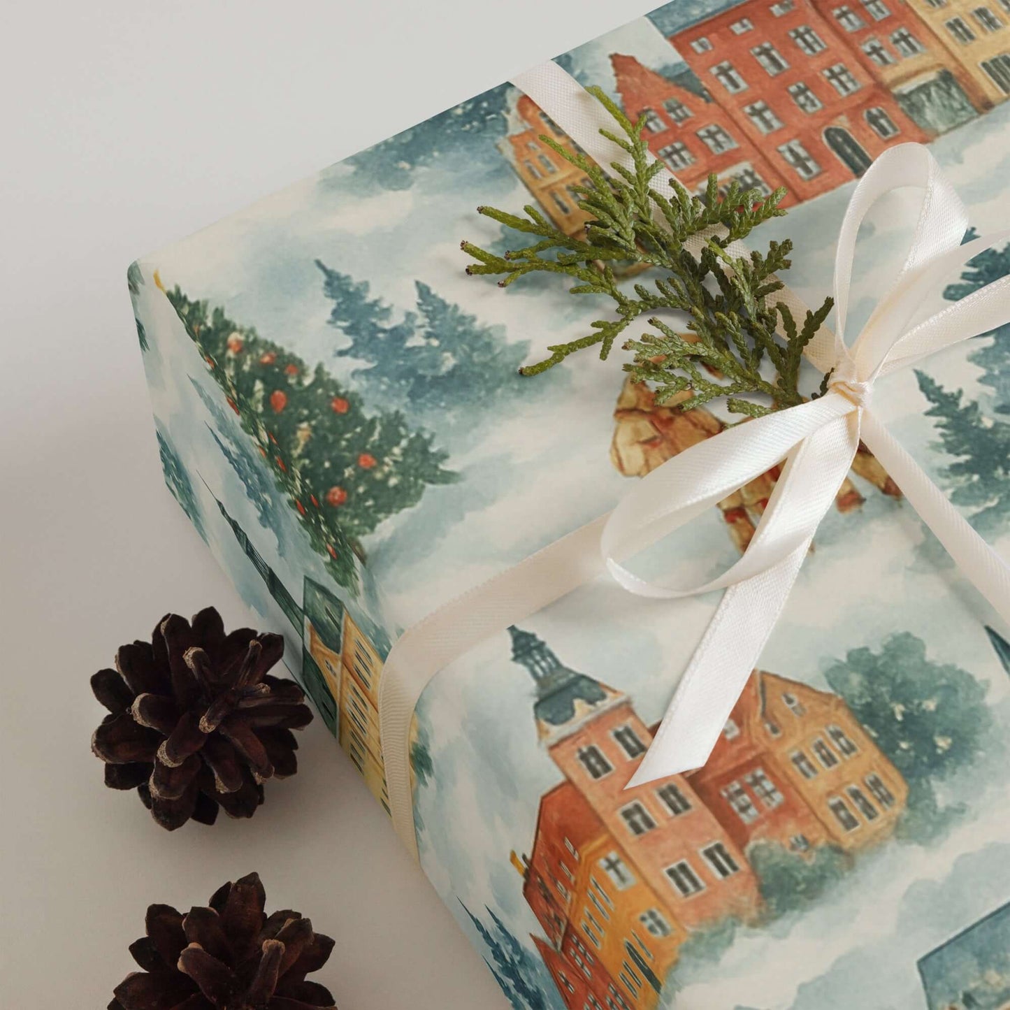 Luxury Christmas wrapping paper featuring Scandinavian watercolor design with snowy villages and festive accents.