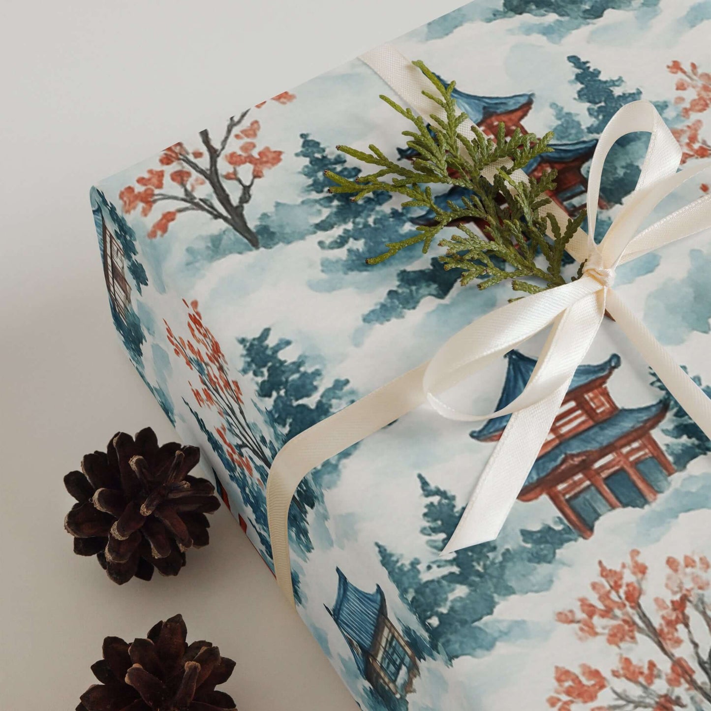 Luxury Christmas wrapping paper featuring watercolor Japanese scene with traditional gates and pinecones.