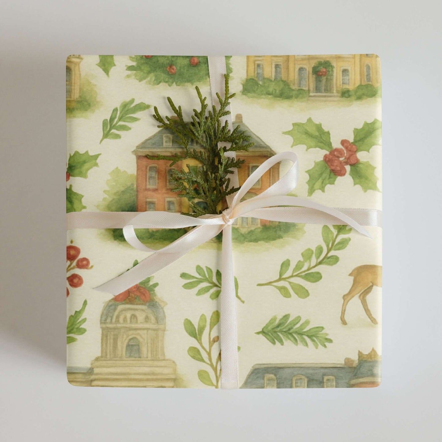 Luxury Victorian Christmas wrapping paper featuring watercolor illustrations of festive architecture and greenery.