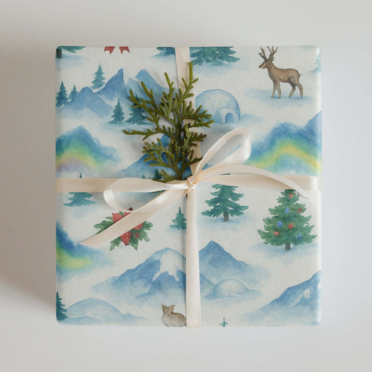 Luxury Christmas wrapping paper with watercolor Arctic wildlife and snowy mountain design, eco-friendly gift wrap.