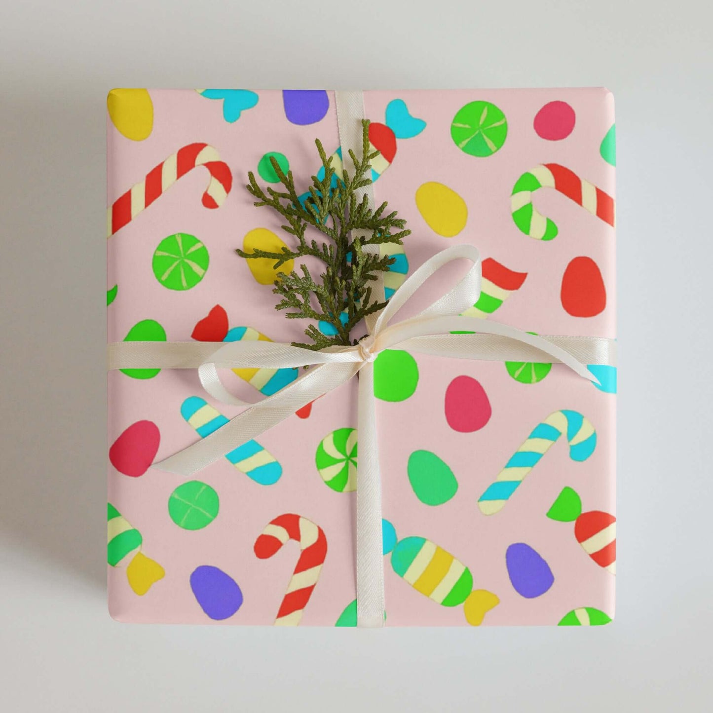 Luxury Christmas wrapping paper with vibrant candy design, featuring candy canes and colorful sweets in a playful watercolor style.