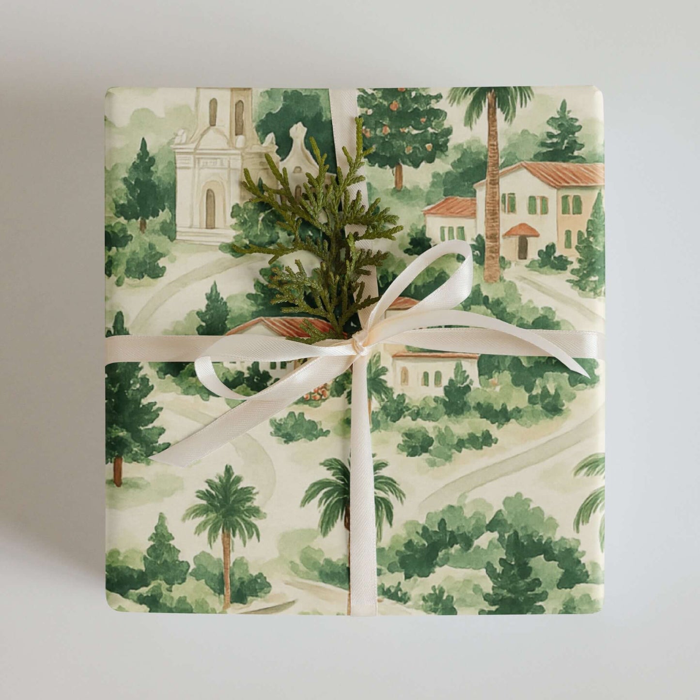 Luxury Christmas wrapping paper featuring hand-painted Mediterranean homes and palm trees, perfect for holiday gift wrap.