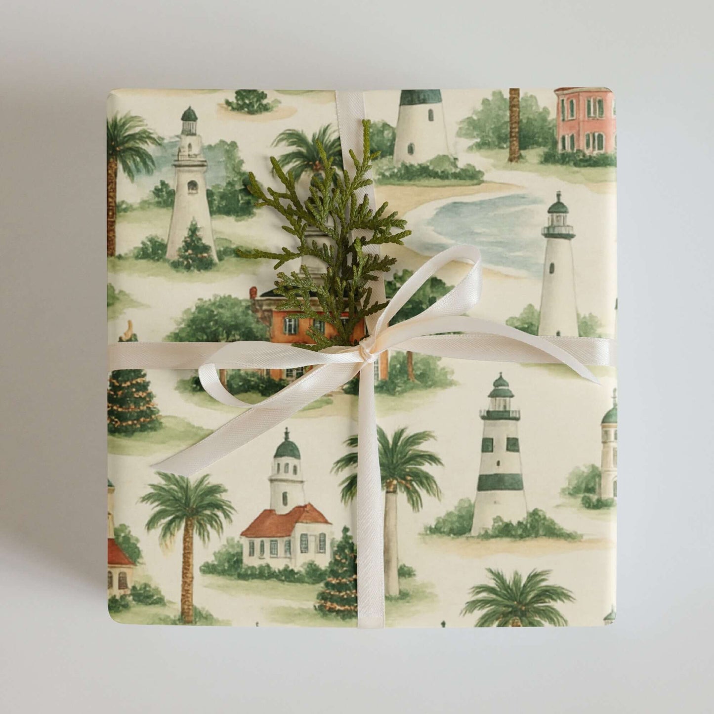 Elegant coastal Christmas wrapping paper featuring lighthouses and palm trees in watercolor design.