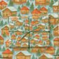 European Christmas Market Wrapping Paper featuring cozy wooden chalets, decorated trees, and festive garlands.