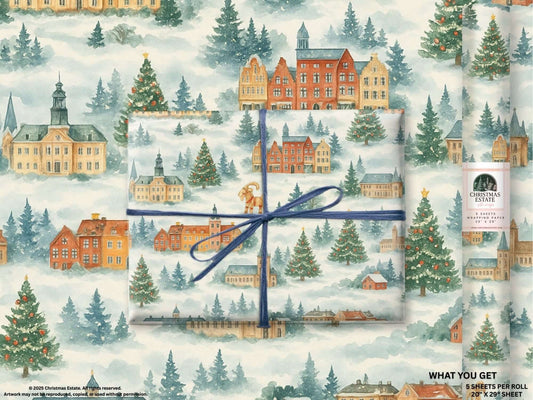 Luxury Christmas wrapping paper featuring a watercolor holiday village scene with snow-covered trees.