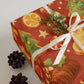 Delightful Baking Christmas Wrapping Paper featuring festive gingerbread cookies, Christmas trees, and holiday treats.
