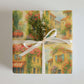 Luxury Christmas wrapping paper featuring a watercolor design of European bistro charm, adorned with fresh greenery.