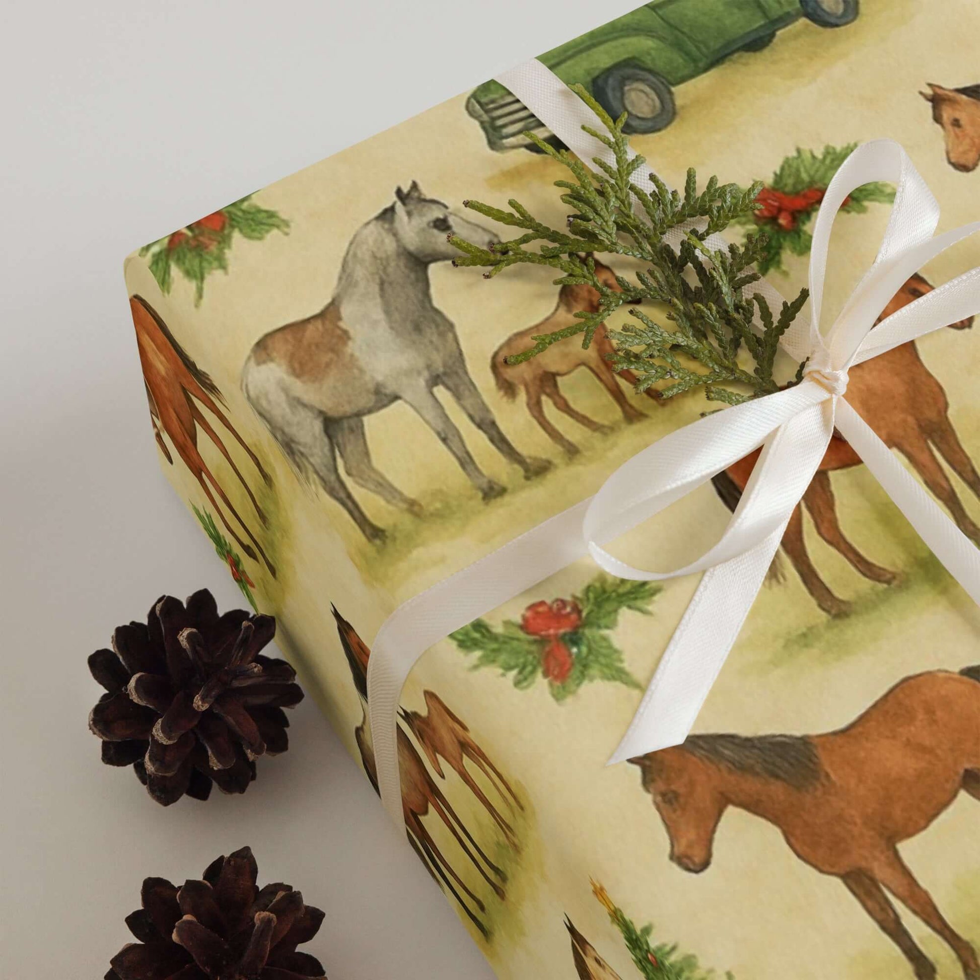 Luxury Christmas wrapping paper featuring watercolor horses and festive greenery, perfect for holiday gift wrap.