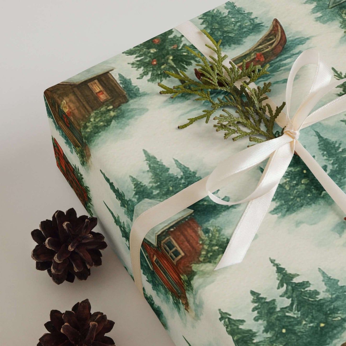 Luxury Christmas wrapping paper with watercolor log cabin and pine tree design, perfect for holiday gift wrap.