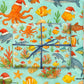 Luxury Christmas wrapping paper featuring vibrant watercolor sea creatures with festive accents, perfect holiday gift wrap.