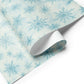 Snowflakes Christmas Wrapping Paper featuring delicate hand-painted snowflakes in icy blue and white.