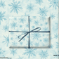 Snowflakes Christmas Wrapping Paper featuring hand-painted snowflakes in icy blue and white, perfect for holiday gifts.