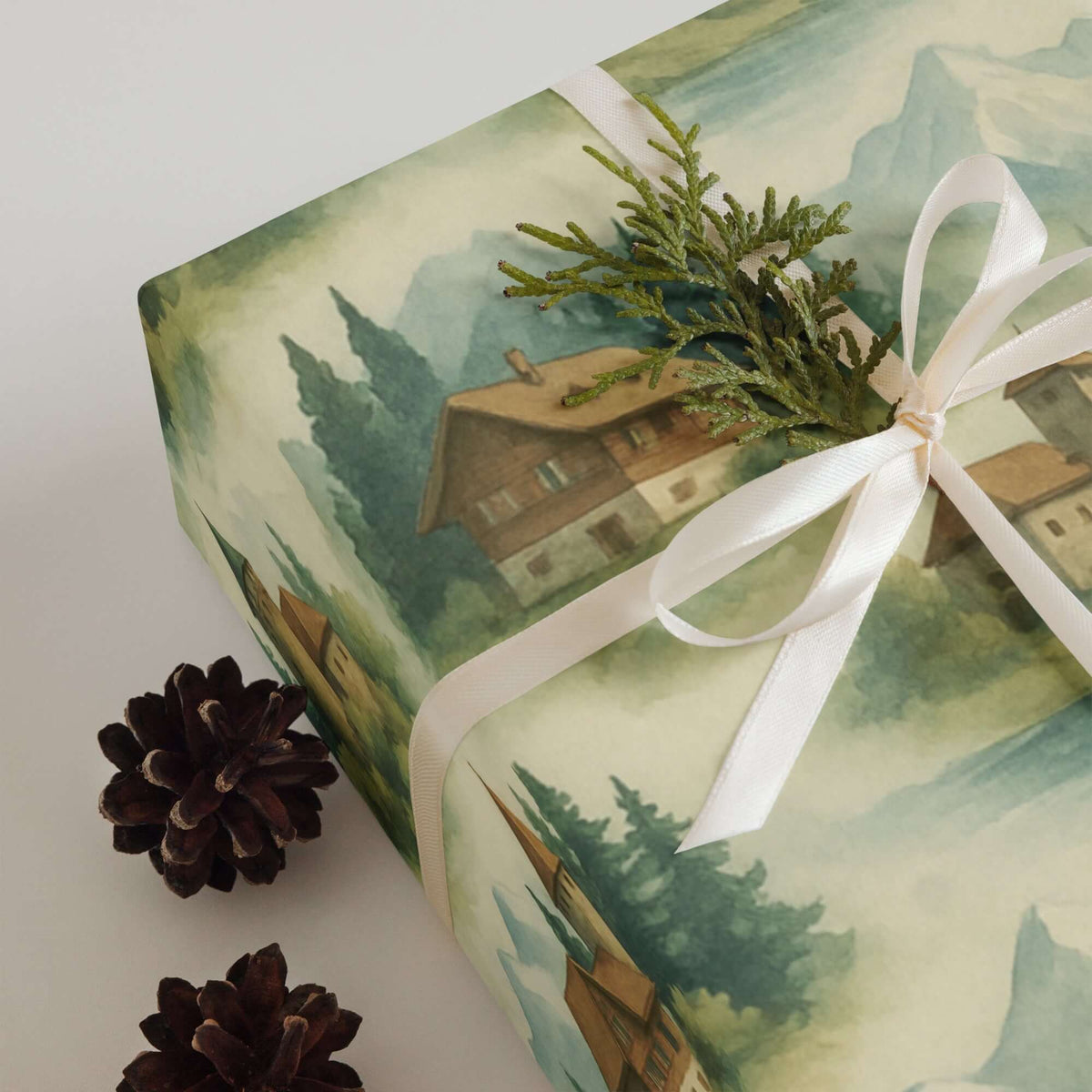 Switzerland Wrapping Paper featuring hand-painted alpine scenes, rustic cottages, and pine accents.