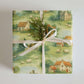 Ireland Wrapping Paper featuring a scenic landscape with cottages, sheep, and meadows, perfect for elegant gift wrapping.