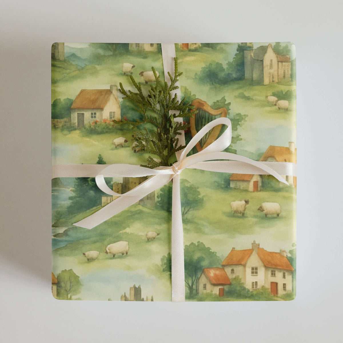 Ireland Wrapping Paper featuring a scenic landscape with cottages, sheep, and meadows, perfect for elegant gift wrapping.