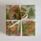 Christmas Market Wrapping Paper featuring a design of festive market stalls and shoppers in a snowy village.