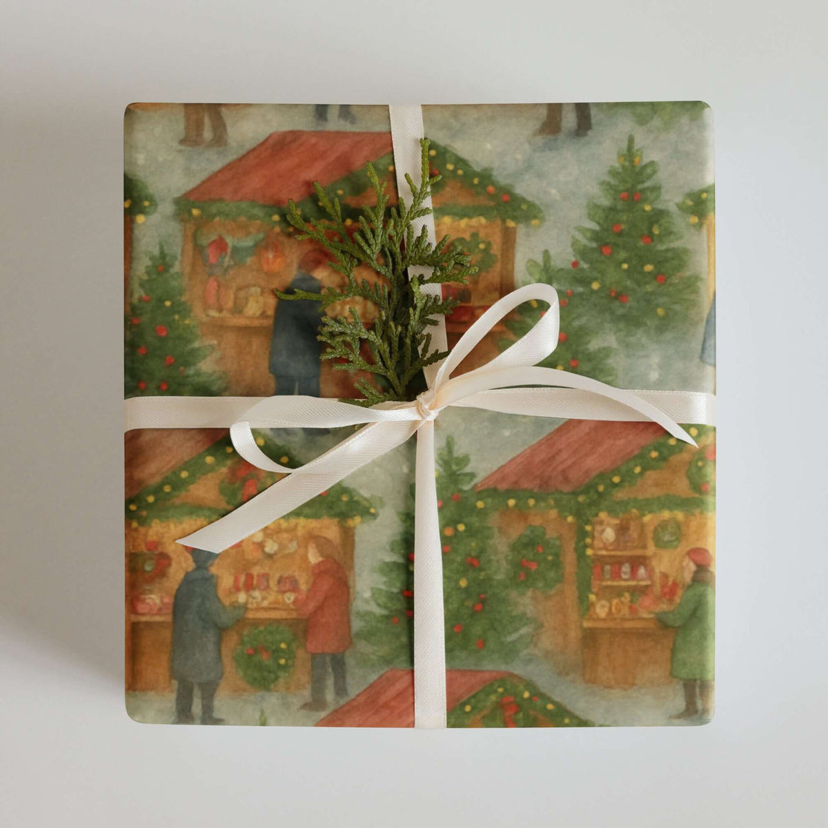 Christmas Market Wrapping Paper featuring a design of festive market stalls and shoppers in a snowy village.