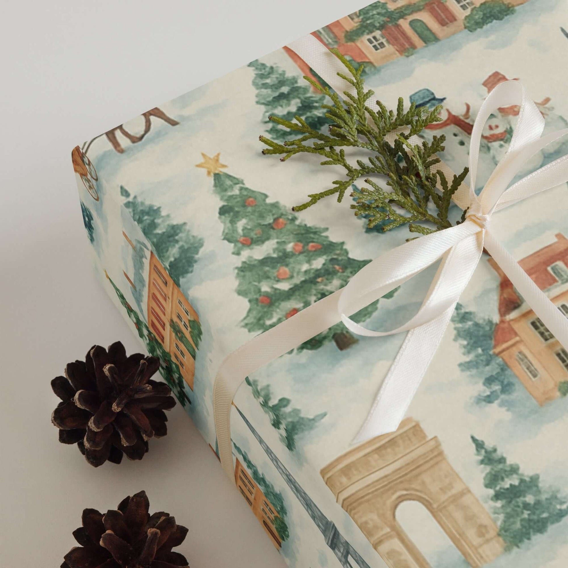 Luxury Christmas wrapping paper featuring watercolor illustrations of Parisian landmarks and holiday decorations.