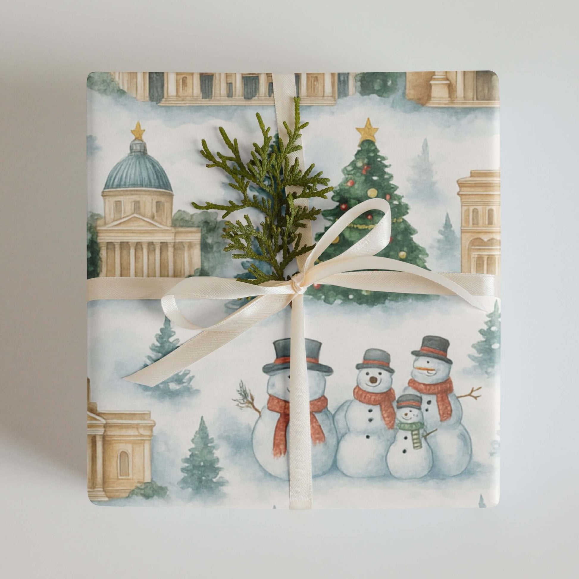 Luxury Christmas wrapping paper featuring watercolor snowmen and iconic landmarks of Rome, tied with a ribbon.