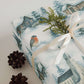 Luxury Christmas wrapping paper with watercolor design featuring snowy landscapes and festive accent.