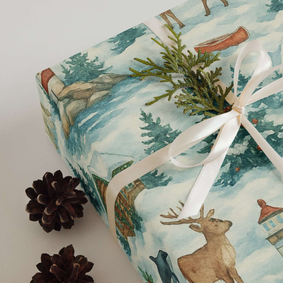 Luxury Alaska Christmas wrapping paper features watercolor design with rustic cabins, wildlife, and winter scenes, perfect for holiday gift wrap.