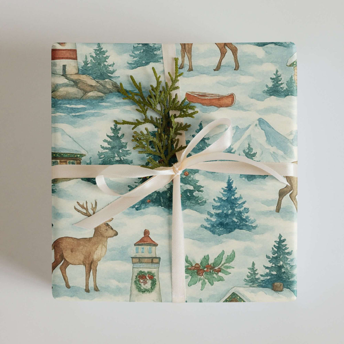 Luxury Christmas wrapping paper featuring watercolor design of reindeer, snowy trees, and festive decor.