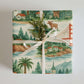 Luxury Christmas wrapping paper featuring watercolor landscapes of California and Oregon with iconic landmarks.