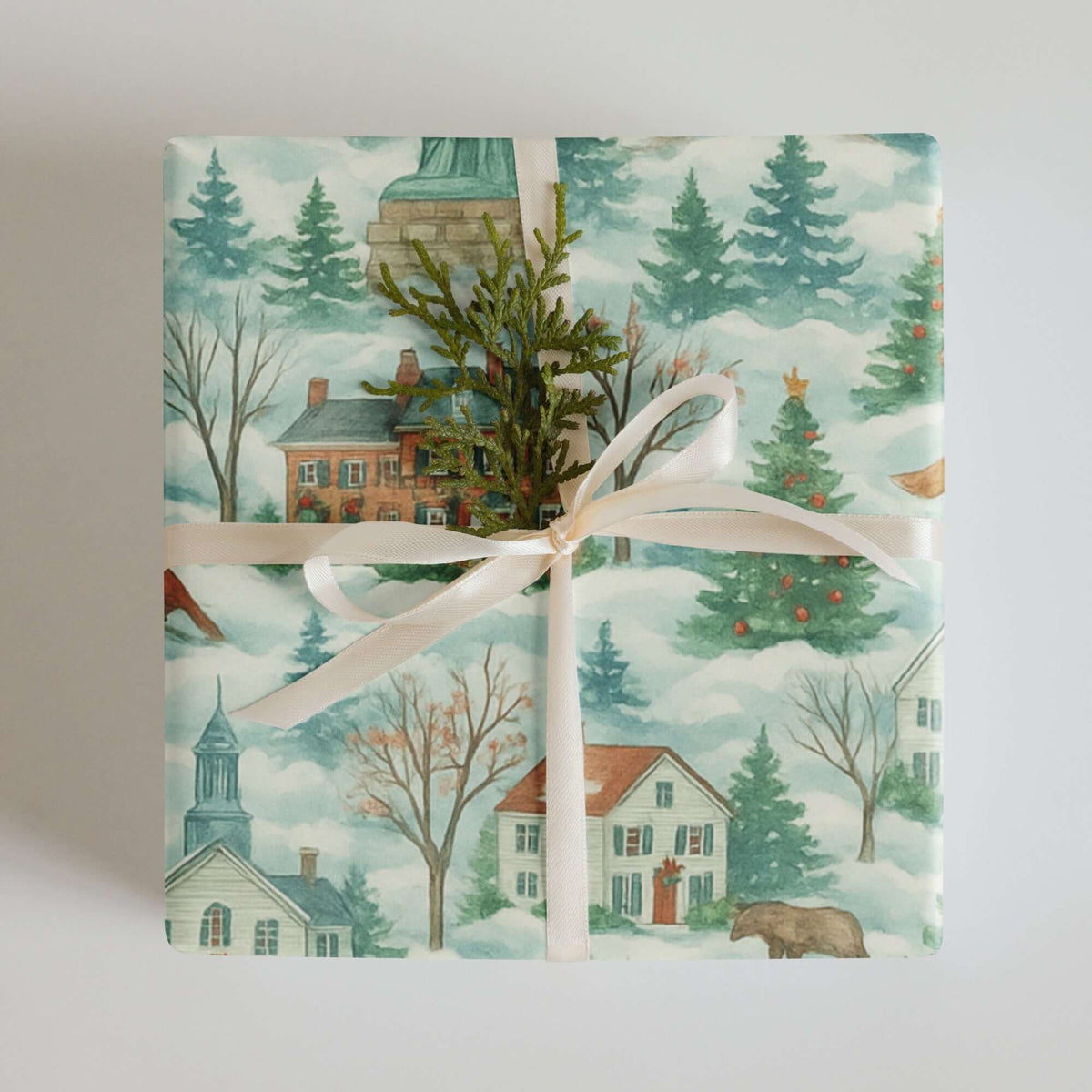 Luxury Christmas wrapping paper featuring watercolor New England scenes, decorated with trees and houses.