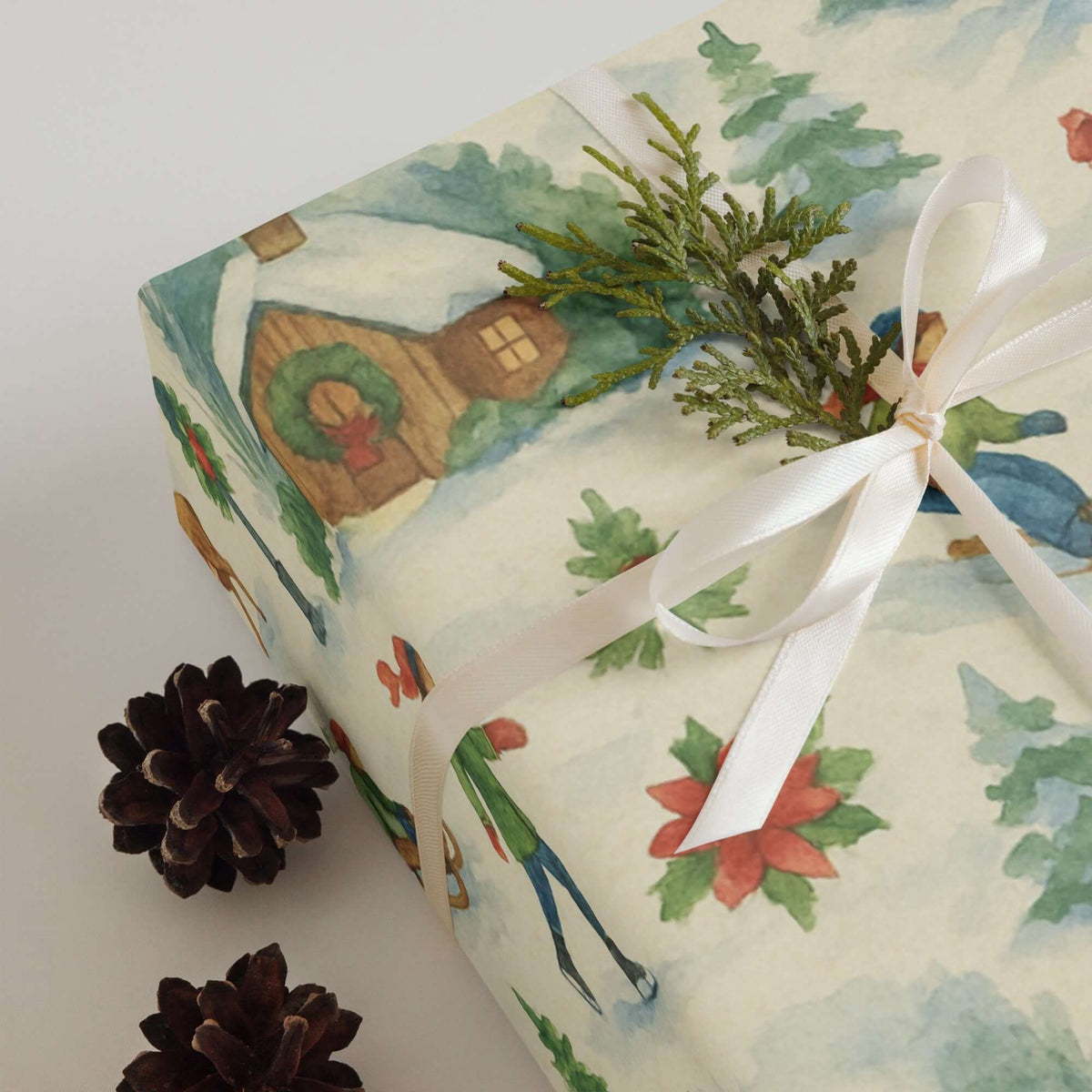 Luxury watercolor Christmas wrapping paper featuring winter sports and decorated cabins, perfect for holiday gift wrap.