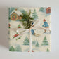 Luxury Christmas wrapping paper featuring watercolor winter sports scenes, eco-friendly, made in USA.