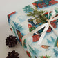 Vibrant watercolor train wrapping paper with pine sprigs on luxury holiday gift wrap.