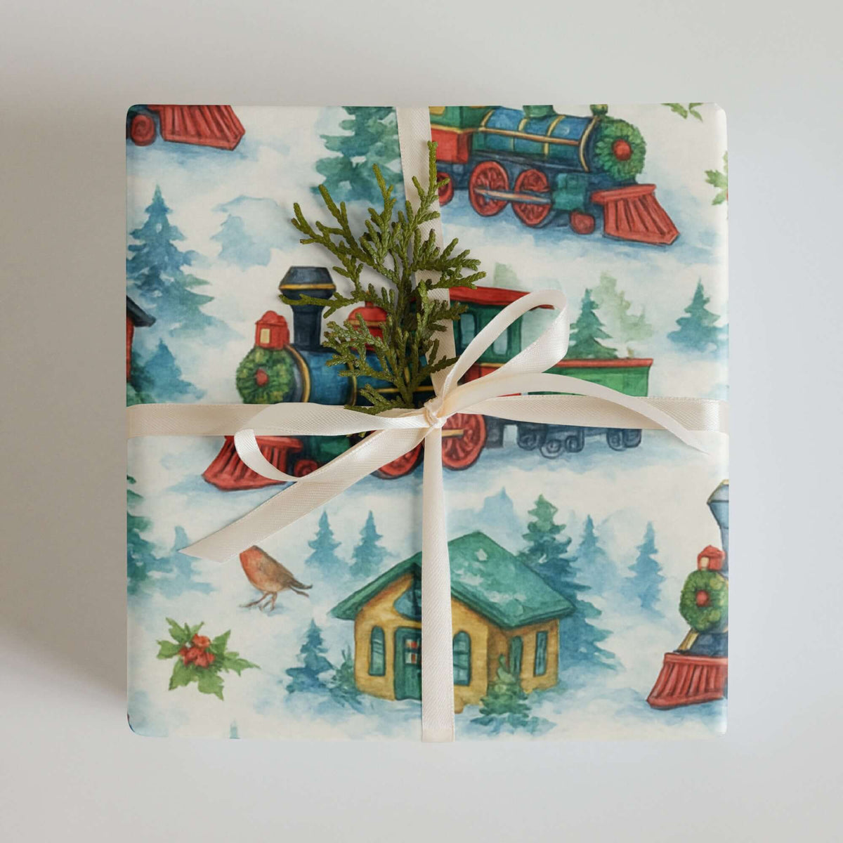 Luxury Christmas wrapping paper featuring vibrant watercolor train design, enhanced with natural greenery.