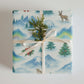 Luxury Christmas wrapping paper with watercolor Arctic wildlife and snowy mountain design, eco-friendly gift wrap.