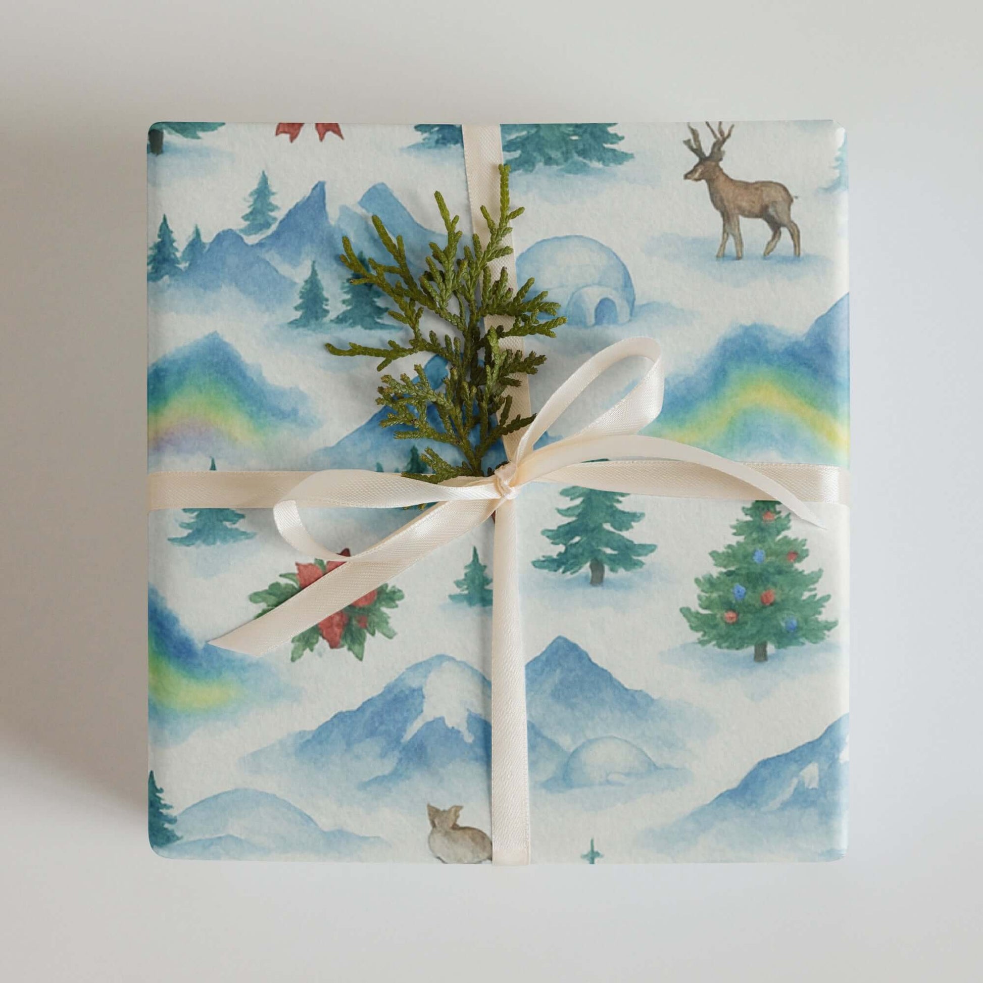 Luxury Christmas wrapping paper with watercolor Arctic wildlife and snowy mountain design, eco-friendly gift wrap.