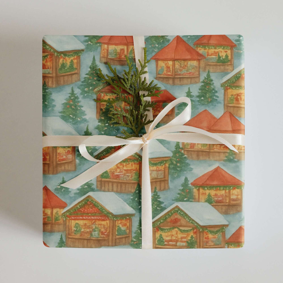 European Christmas Market Wrapping Paper featuring cozy village chalets and festive decorations.