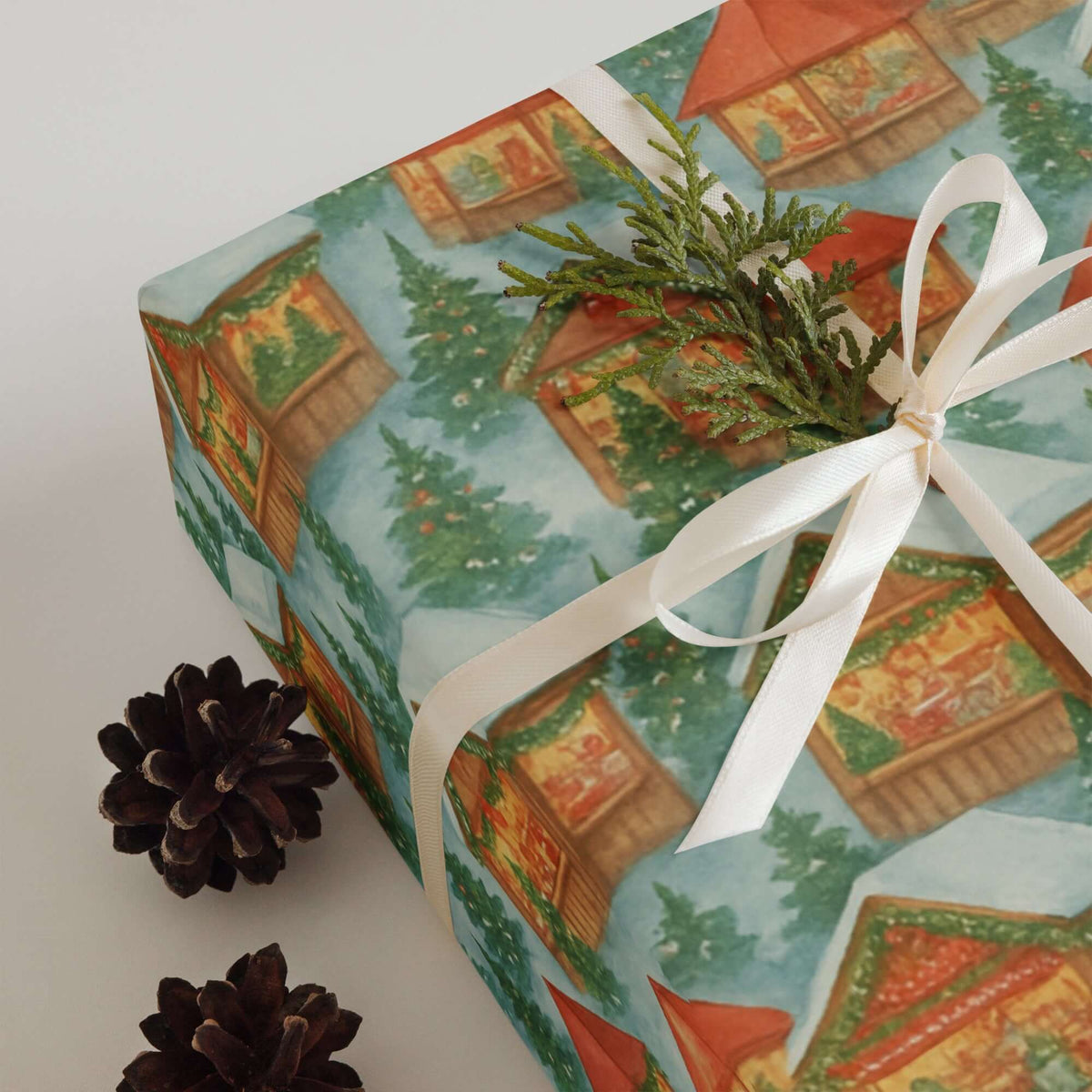 European Christmas Market Wrapping Paper featuring cozy wooden chalets, evergreen trees, and festive garlands, perfect for holiday gifts.